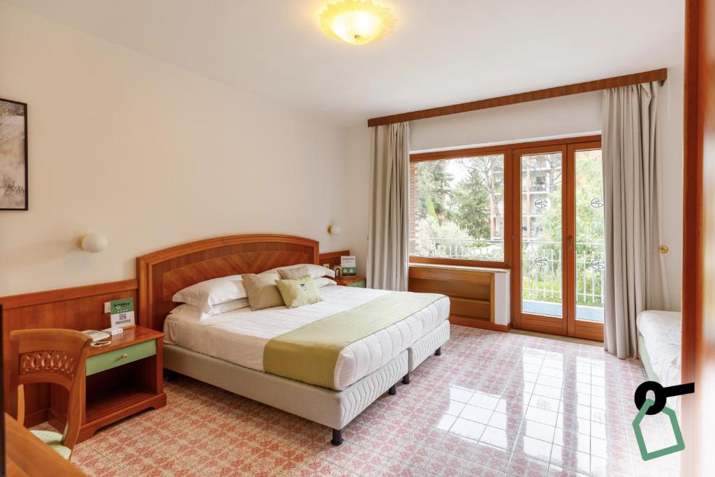 Katil atau katil-katil dalam bilik di HOTIDAY Room Collection - Sorrento