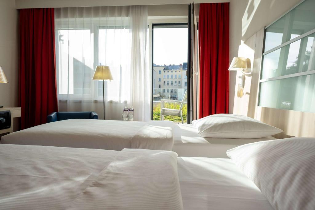 Cama ou camas em um quarto em Park Inn by Radisson Linz