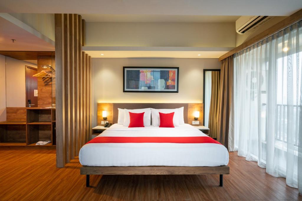 Ramada by Wyndham Serpong में एक कमरे में एक या कई बेड