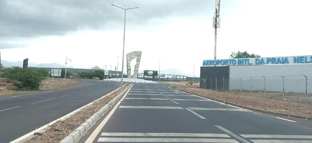 an empty road with a sign on the side of it at Casa Do Encanto in Praia