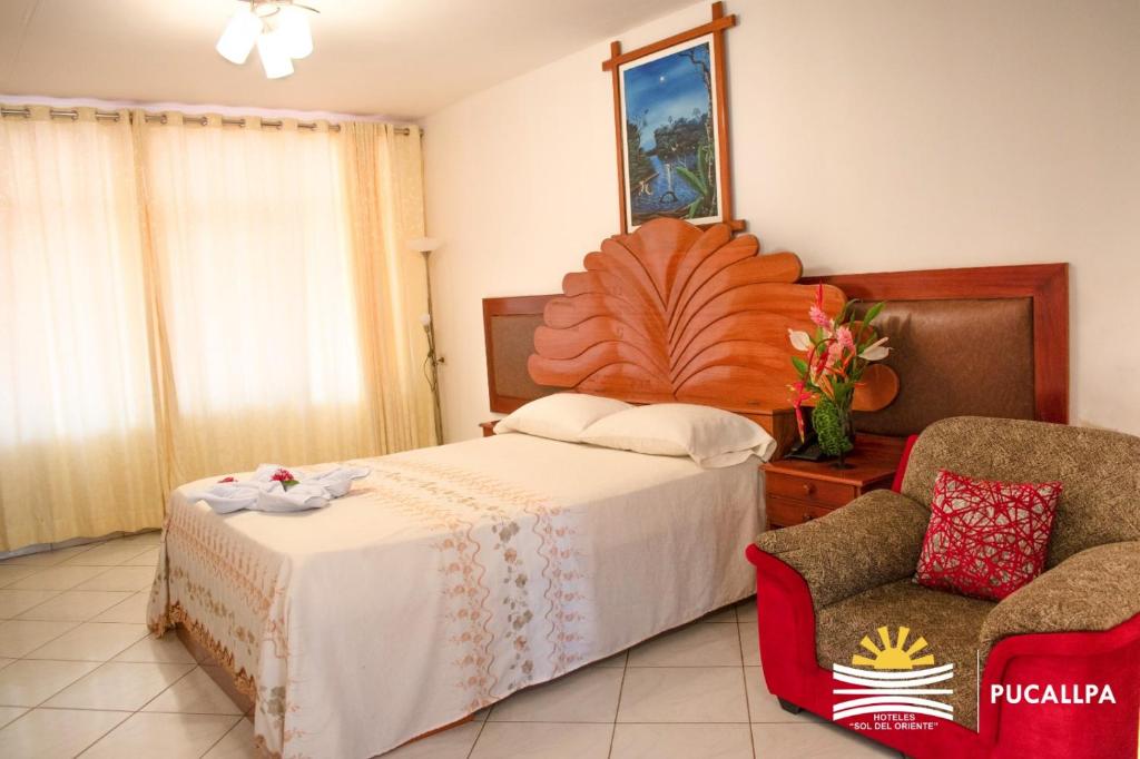 A bed or beds in a room at Hotel Sol del Oriente Pucallpa