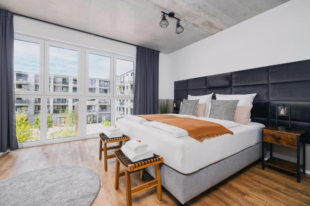 Svyvo Cologne - Serviced Apartments Ehrenfeld房間的床