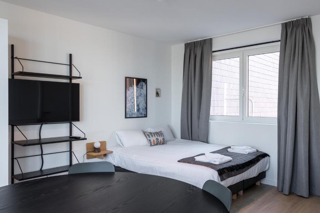 Giường trong phòng chung tại Smartflats - Leuven Central