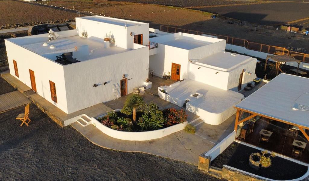 an aerial view of a white house with a courtyard at Finca Isolina Hotel Boutique - Adults Recommended in Mácher