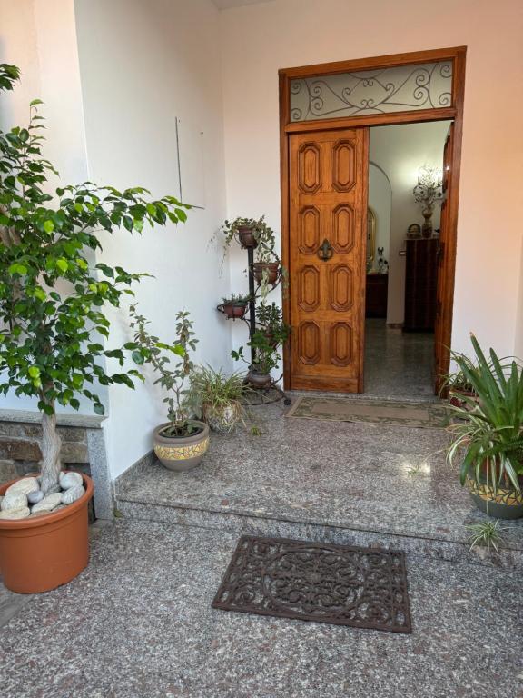 an entry door to a house with potted plants at Da Gio in Olbia