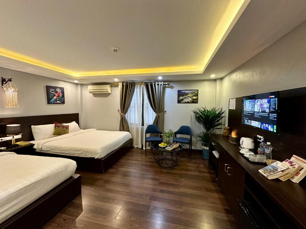 Tempat tidur dalam kamar di HeLLo Sapa Hotel