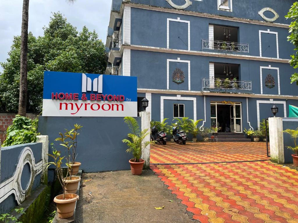 a home and beyond my room sign in front of a building at home and beyond by myroom in Goa