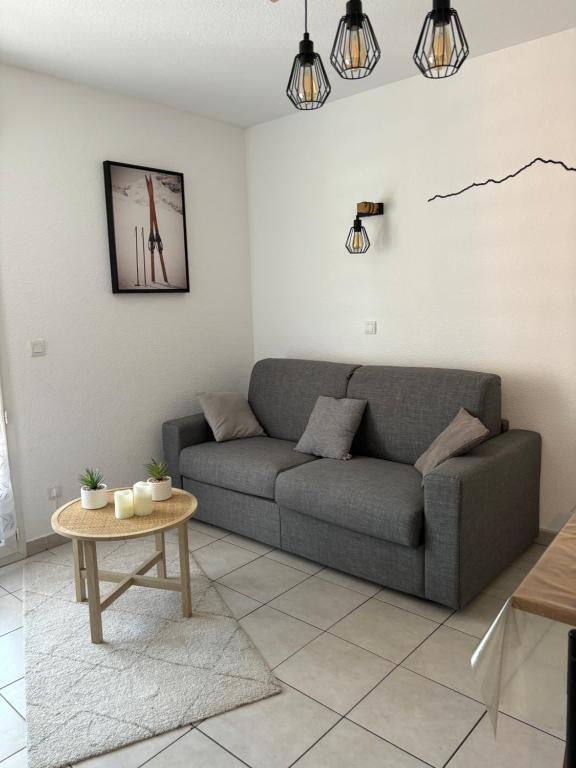 Zona d'estar a Appartement cosy rue Pasteur