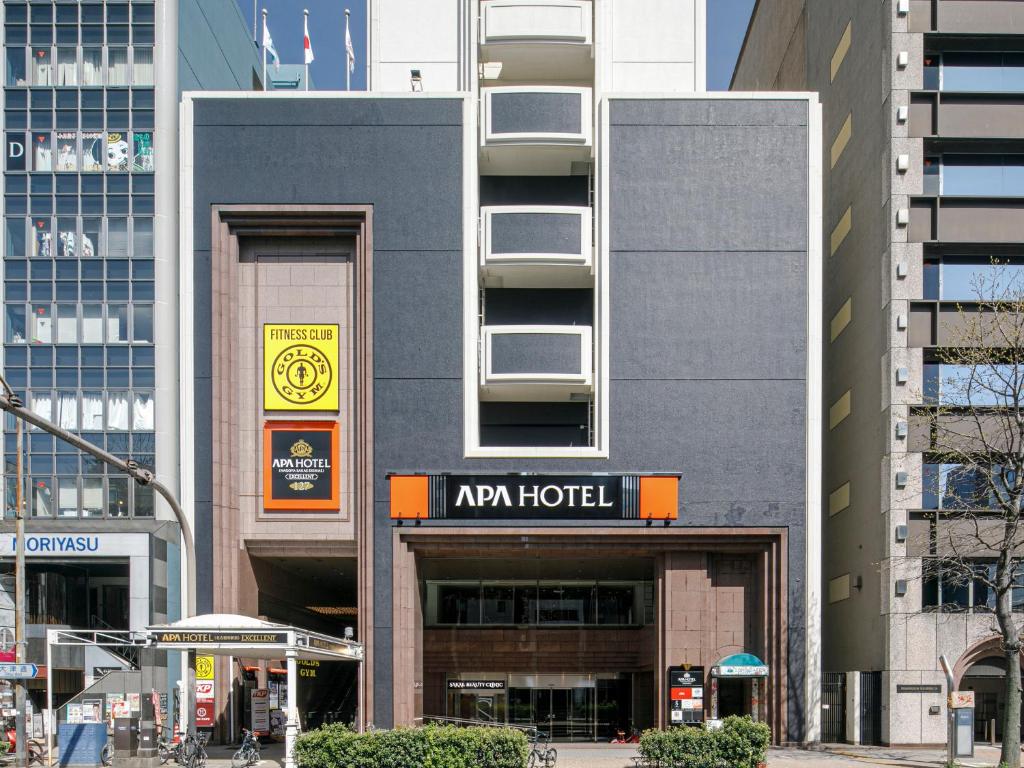 een gebouw met een bordje aronia in een stad bij APA Hotel Nagoya Sakae Ekimae EXCELLENT in Nagoya