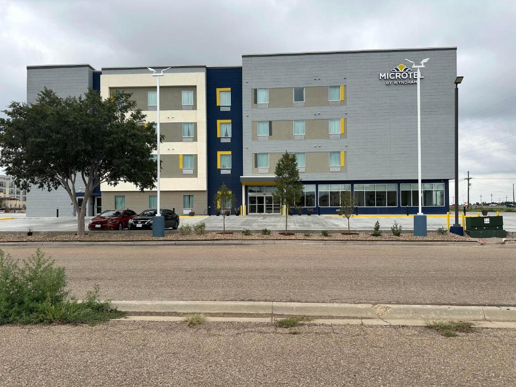 a building with a market sign on the side of it at Microtel Inn & Suites by Wyndham Amarillo West in Amarillo