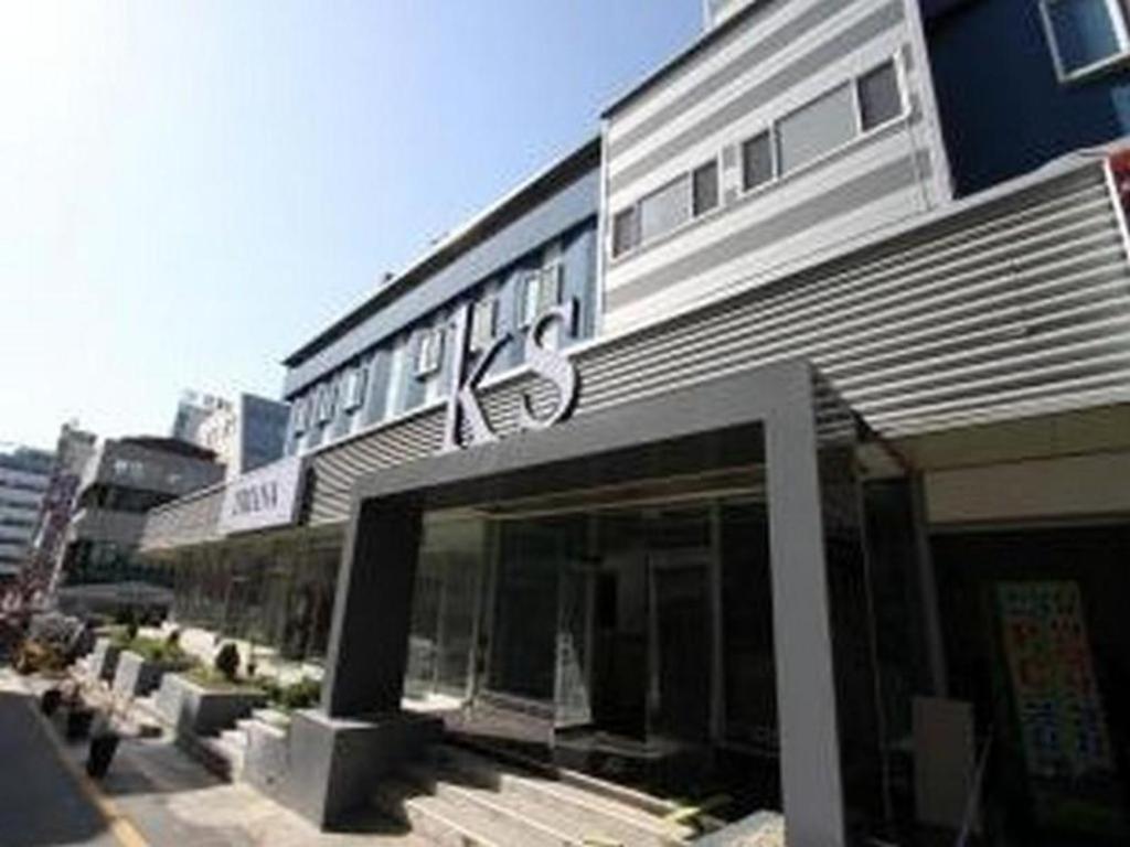 a building with a sign on the front of it at K.S Hotel in Cheonan