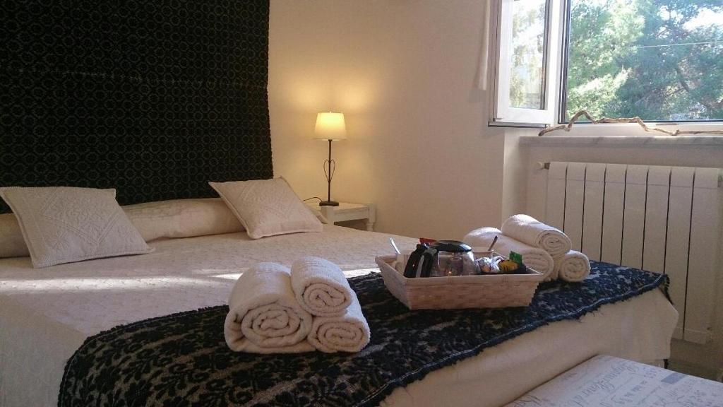 A bed or beds in a room at Anna Rita Alghero B&B