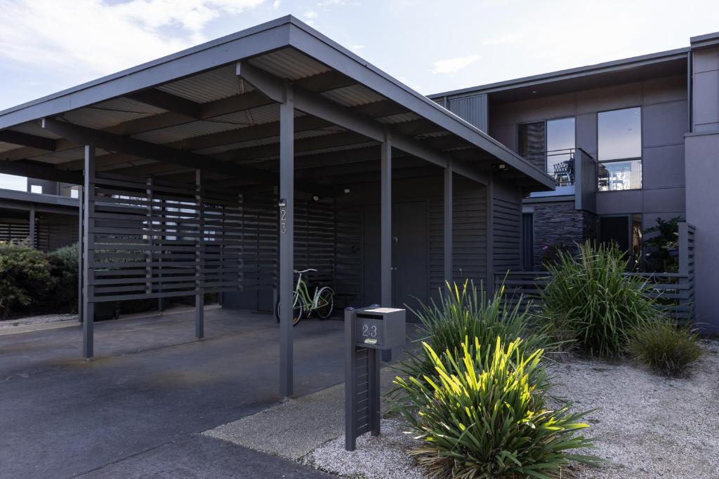 a building with a parking meter in front of it at Torquay Golf Retreats - Pool, Beach, Tennis, Golf in Torquay