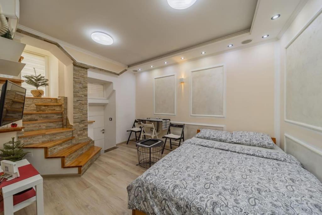 Una cama o camas en una habitación de Megi Zemun Apartment