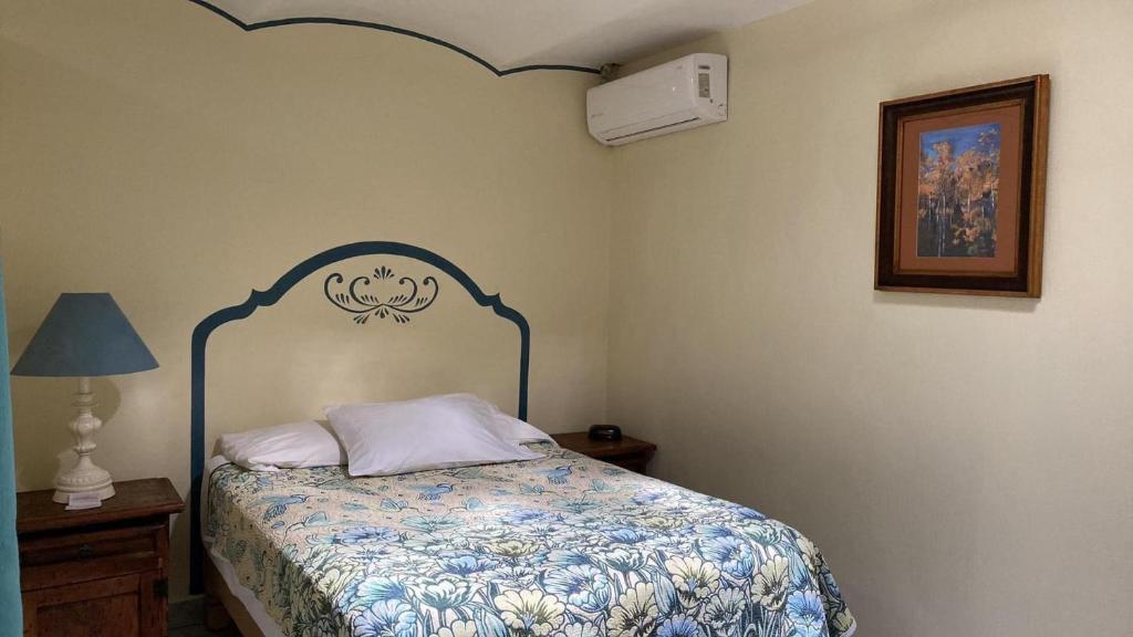 Una cama o camas en una habitación de Casa Vida Bella