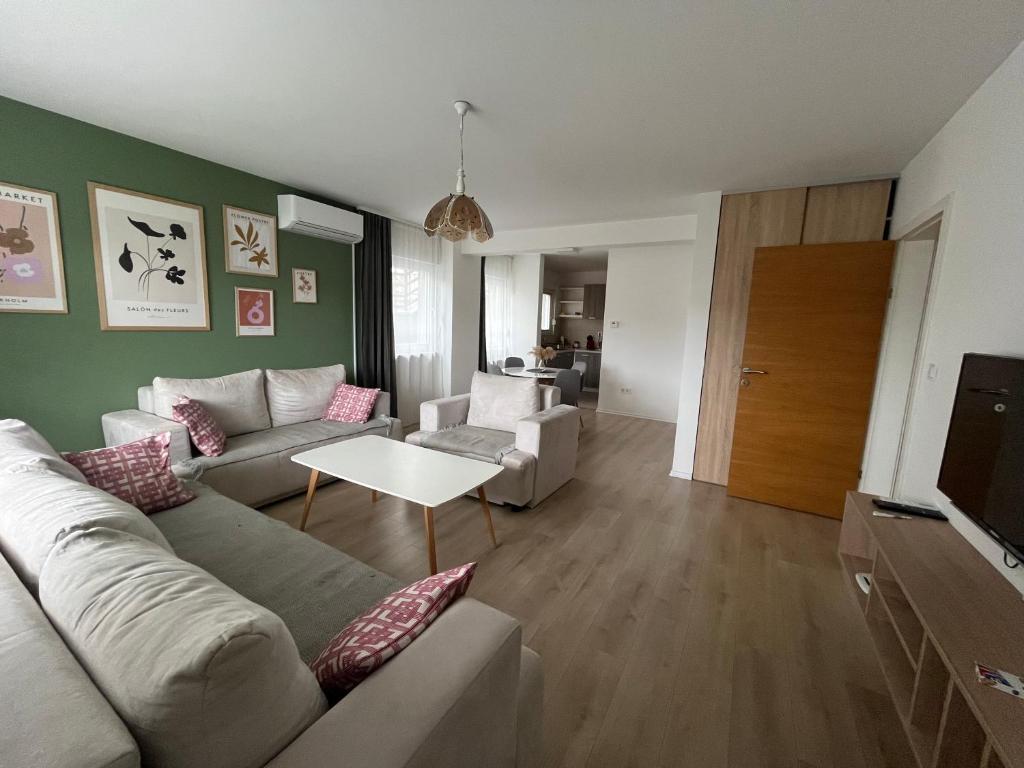 a living room with a couch and a table at Apartment Mejdan in Tuzla