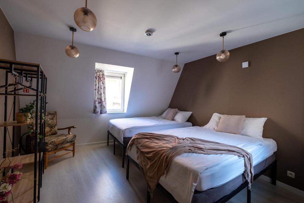 Cama ou camas em um quarto em Huize 'De Moriaan' in Historic Center