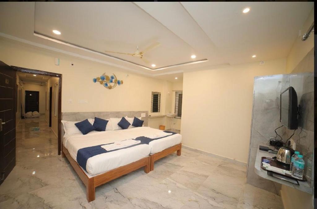 Cama ou camas em um quarto em Sri Ganesh Residency