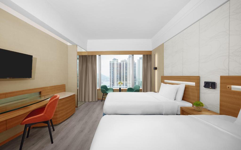 Rúm í herbergi á Nina Hotel Tsuen Wan West