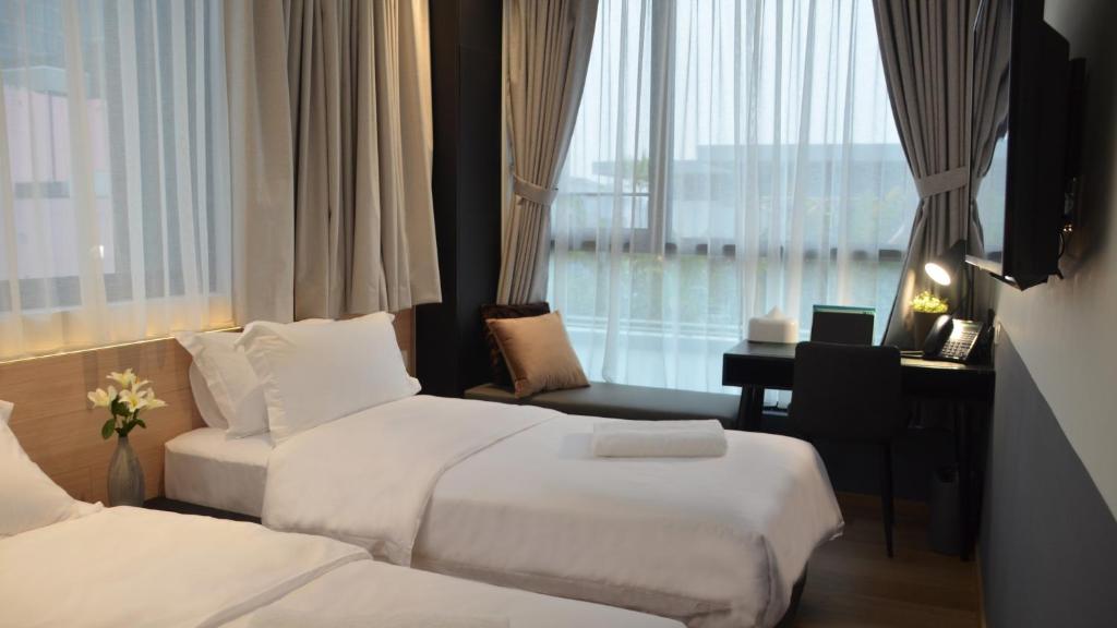 Tempat tidur dalam kamar di VicHaus Serviced Apartment