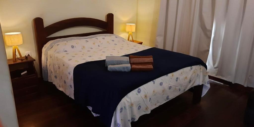 Una cama o camas en una habitación de Casa Duplex a 450m da Praia do Peró - Cabo Frio