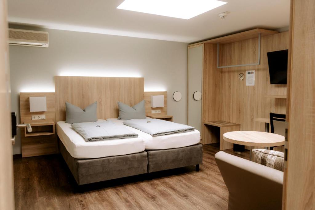 Una cama o camas en una habitación de Hotel Herbers Efemir GmbH