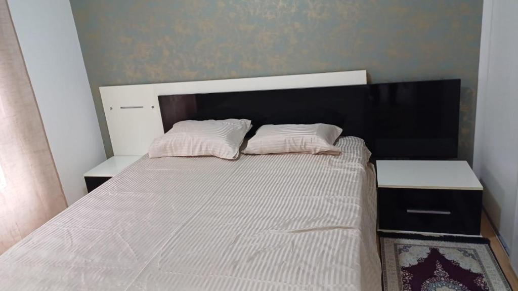 Кровать или кровати в номере Bel appartement Type F2 vaux en velin Village 69120