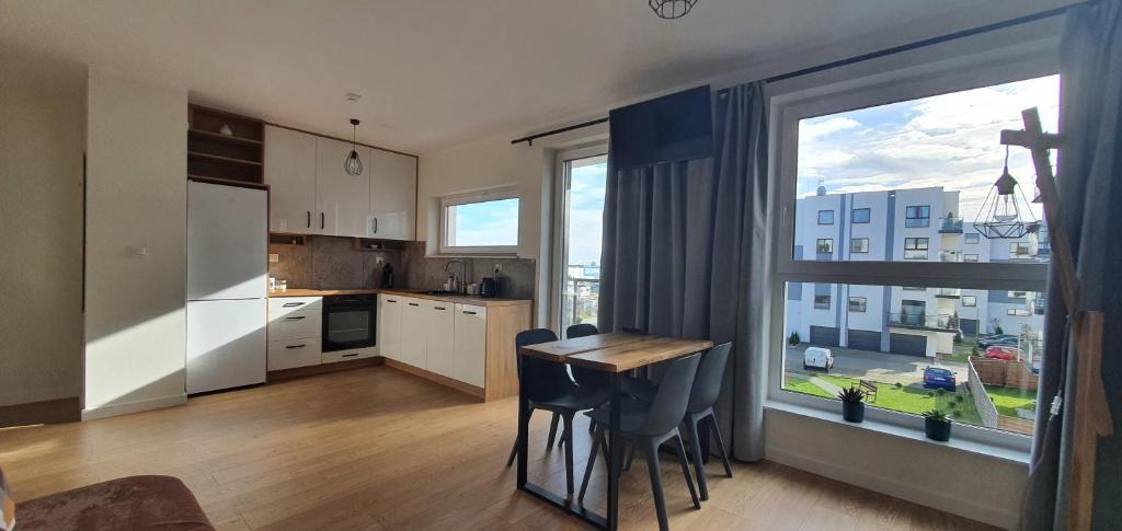 Kuchyňa alebo kuchynka v ubytovaní Oak Apartament Rumia Aquapark