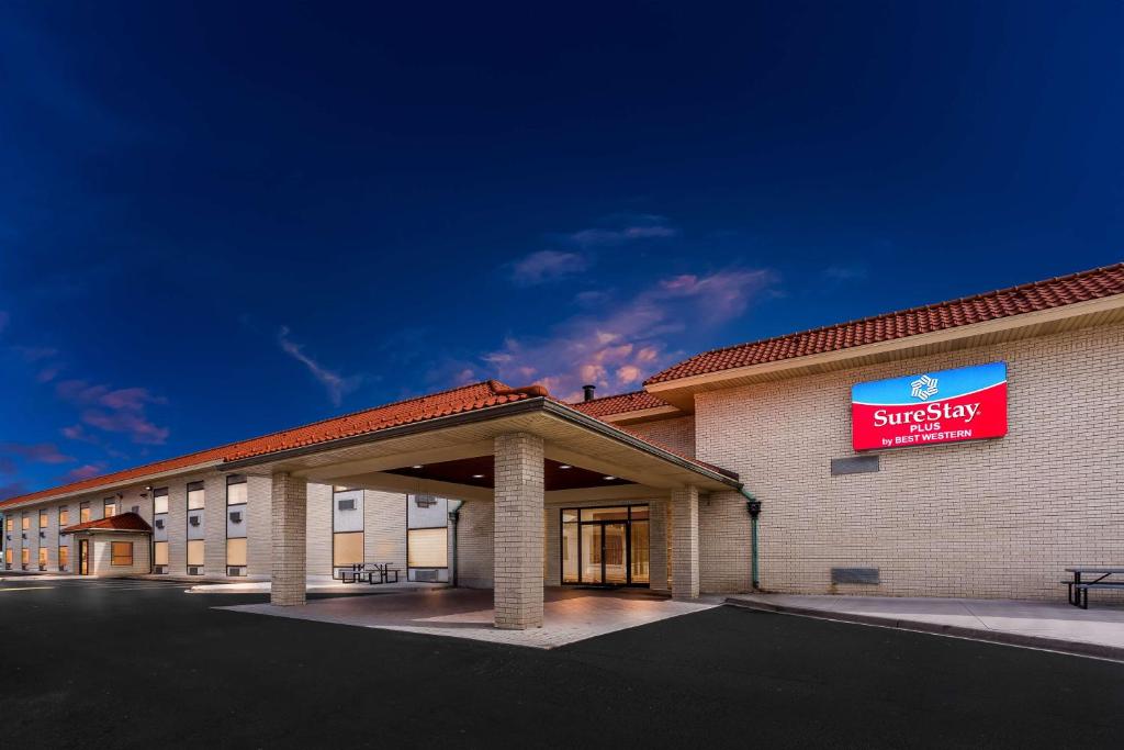 a building with a sign on the side of it at SureStay Plus by Best Western Windsor in Windsor