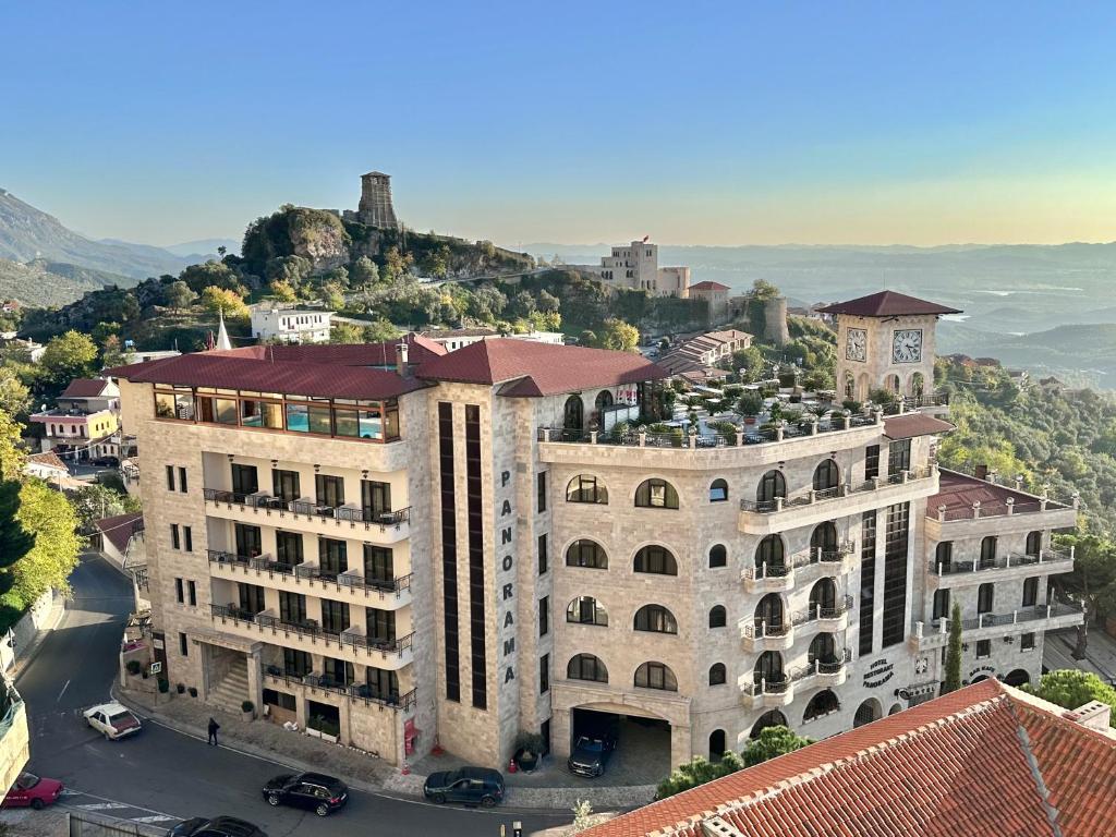 an aerial view of a building with a mountain in the background at Hotel PANORAMA Kruje view on the castle and the old town in Krujë