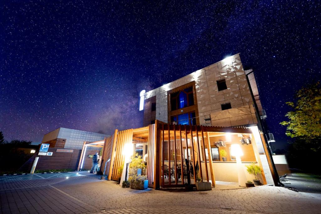 a building at night with a starry sky at Hotel Agit Congress&Spa in Lublin