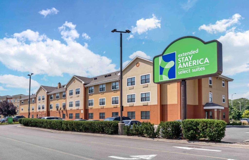 a hotel sign in front of a building at Extended Stay America Select Suites - Chicago - O'Hare in Rosemont