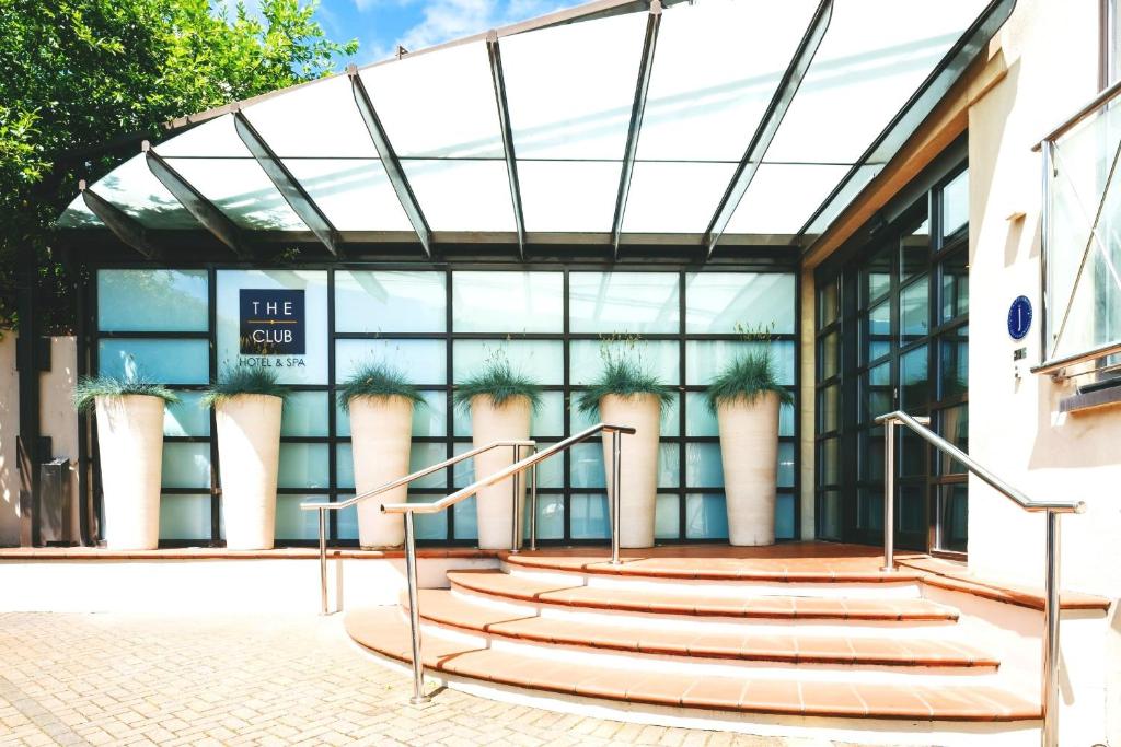 a glass building with stairs in front of it at The Club Hotel & Spa Jersey in Saint Helier Jersey