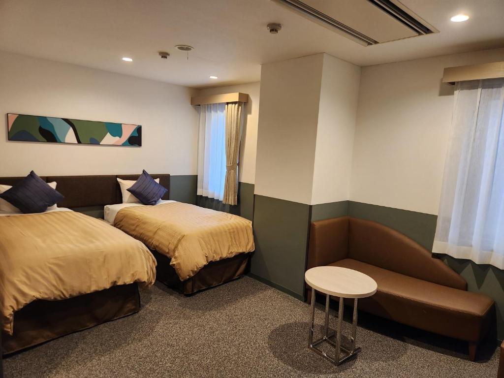 Gulta vai gultas numurā naktsmītnē Sun Royal Kawasaki - Vacation STAY 54523v