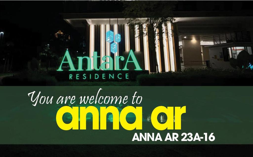 um sinal em frente a uma residência americana com um edifício em ANNA AR ANTARA RESIDENCE LAKE VIEW, Putrajaya em Putrajaya