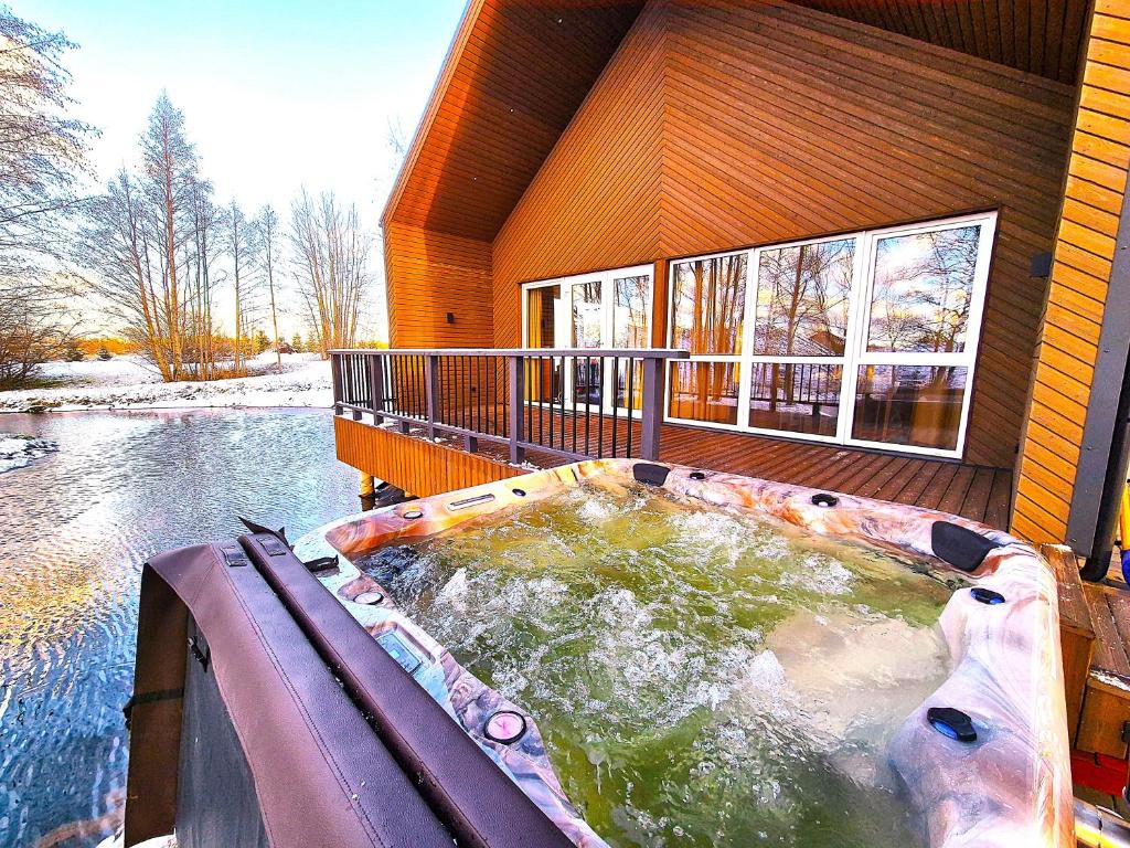 Снимка в галерията на Župė Dream House with jacuzzi and sauna в Клайпеда