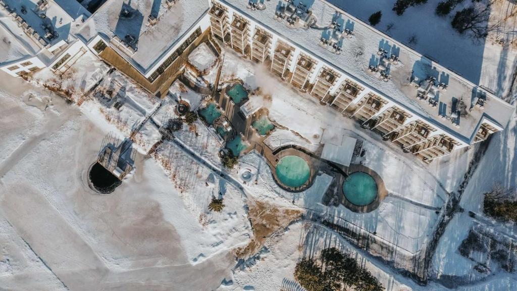 an overhead view of a building with green water at Estérel Resort in Esterel