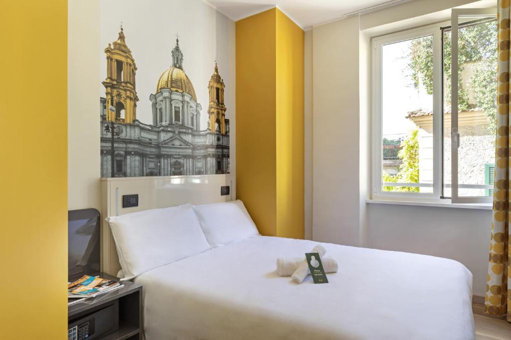 Lova arba lovos apgyvendinimo įstaigoje B&B Hotel Roma San Lorenzo Termini