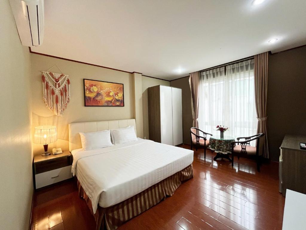 Ліжко або ліжка в номері La Palma - Garden Saigon Hotel Phu My Hung