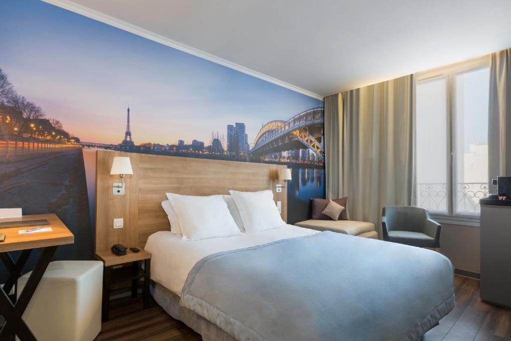 Krevet ili kreveti u jedinici u okviru objekta Best Western Rives de Paris La Defense