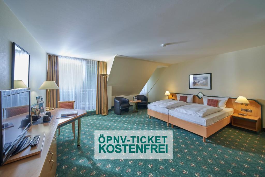 Balance Hotel Leipzig Alte Messe tesisinde bir odada yatak veya yataklar