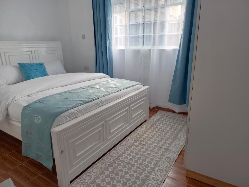 A bed or beds in a room at The kioka gardens 2 bedroom stand alone