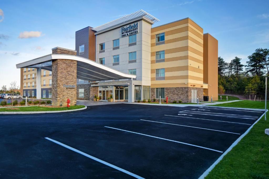 an empty parking lot in front of a hotel at Fairfield Inn & Suites by Marriott Plymouth in Plymouth