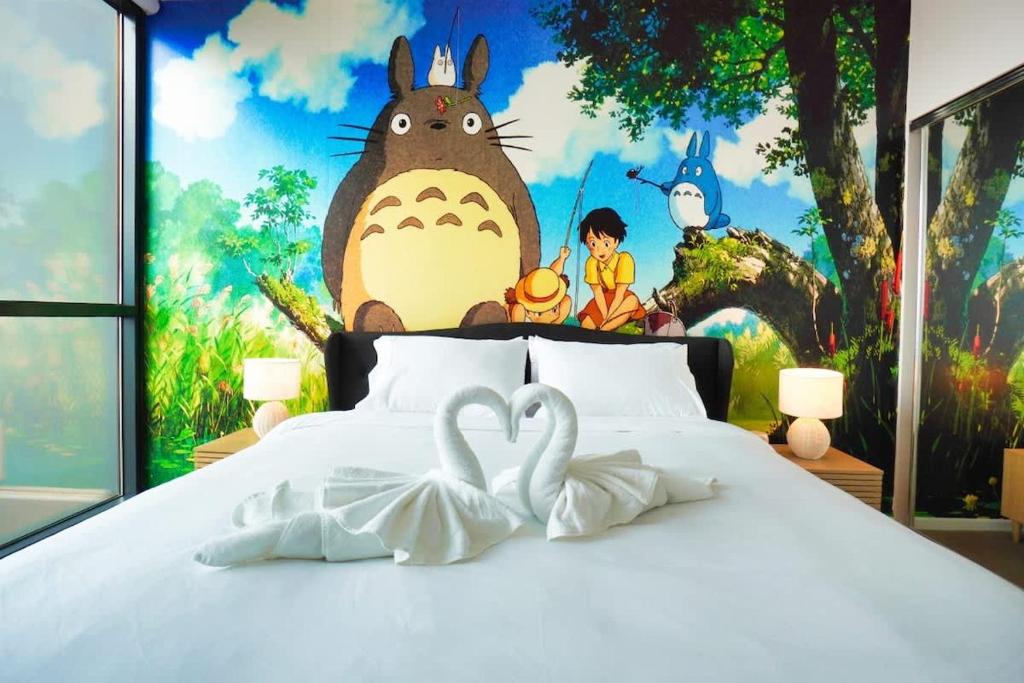 A bed or beds in a room at Unique Ghibli Theme Apt-Pool-Gym-Sauna-Steam Room