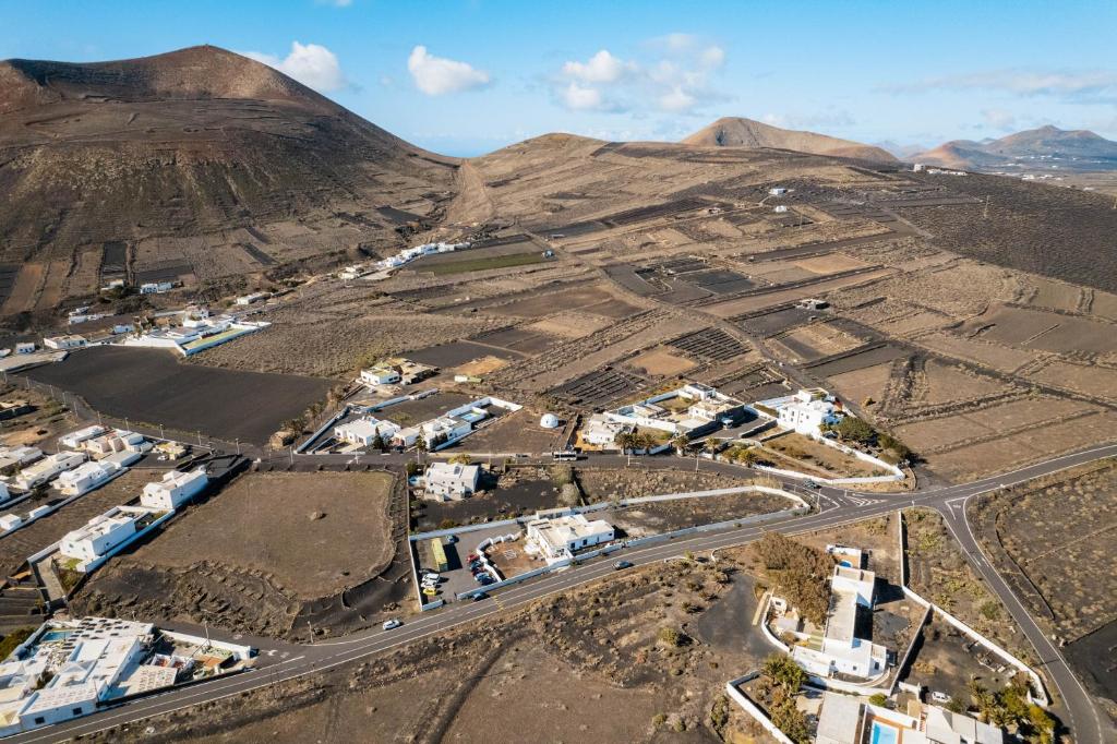 an aerial view of a village in the mountains at hotel rural GA7COLORES only adult in Montaña Blanca