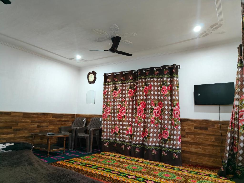 A television and/or entertainment centre at Reshi guest house