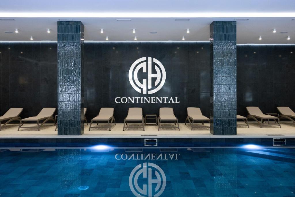 a conference room with chairs and a swimming pool at Continental SPA Resort in Bukovel