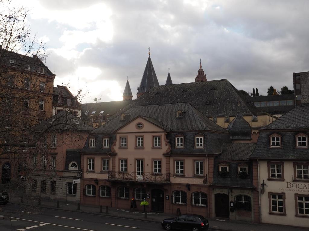 a group of buildings on a city street at Hotel Havana in Mainz