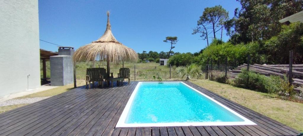 a small swimming pool on a wooden deck at Solar de la Viuda in Punta Del Diablo