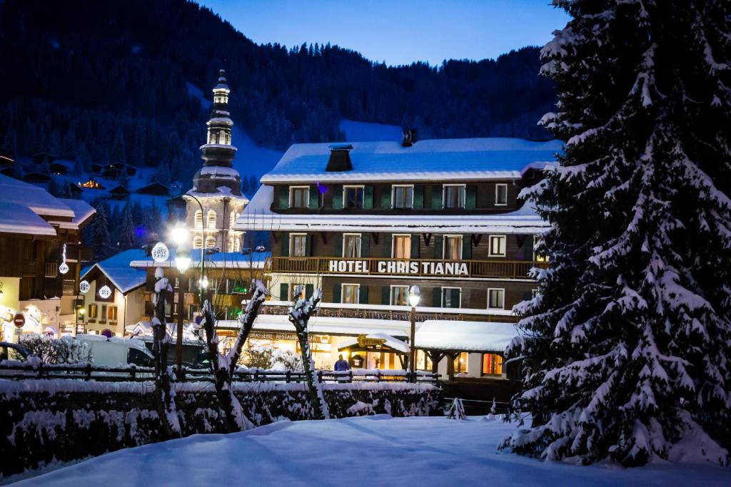 a hotel in the snow in front of a building at Hotel Christiania in La Clusaz